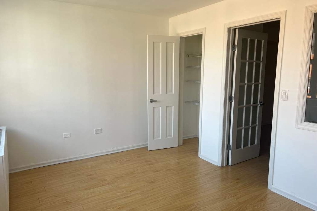 222 West 14th Street, Unit 6H Manhattan, NY 10011 - Photo 11 of 14 an empty room with closet area