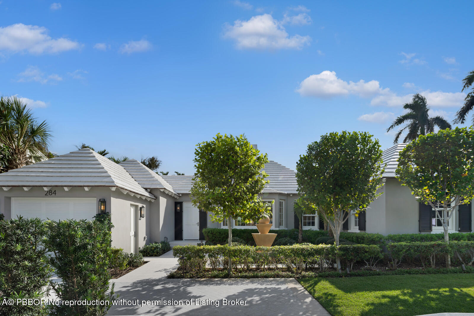 284 Monterey Road Palm Beach, FL 33480 - Photo 19 of 21 a front view of a house with garden
