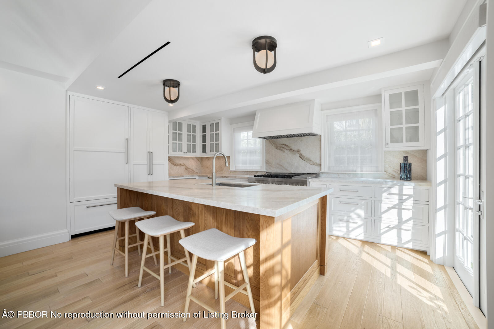 284 Monterey Road Palm Beach, FL 33480 - Photo 7 of 21 a kitchen with a table and chairs in it