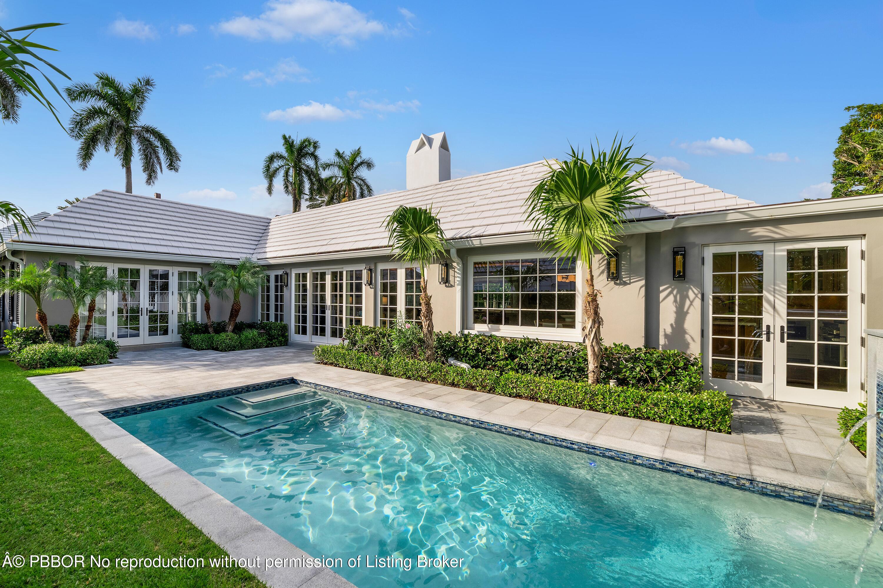 284 Monterey Road Palm Beach, FL 33480 - Photo 8 of 21 a front view of a house with a yard