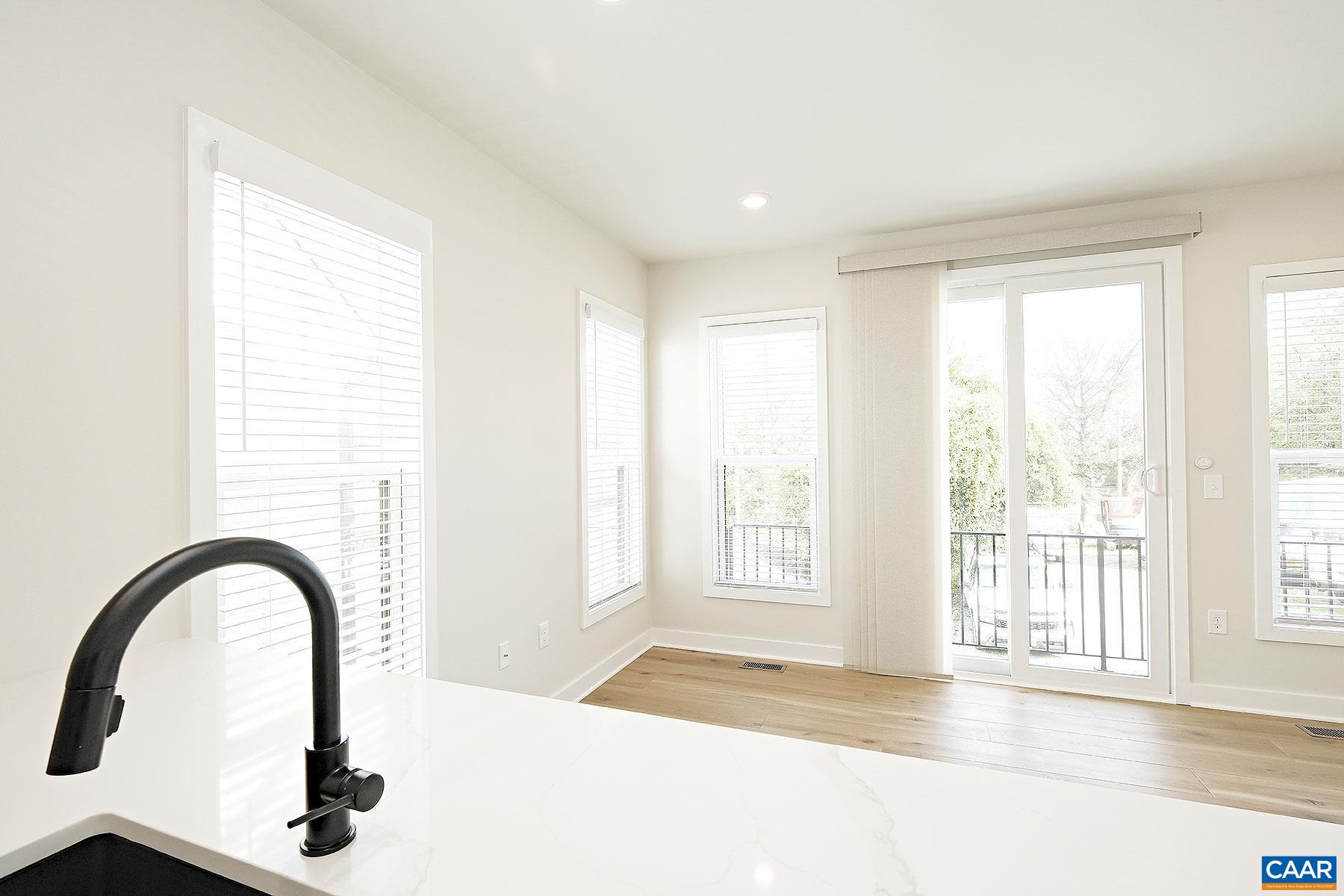 917 Belmont Avenue, Unit A Charlottesville, VA 22902 - Photo 3 of 11 a view of an empty room with a window