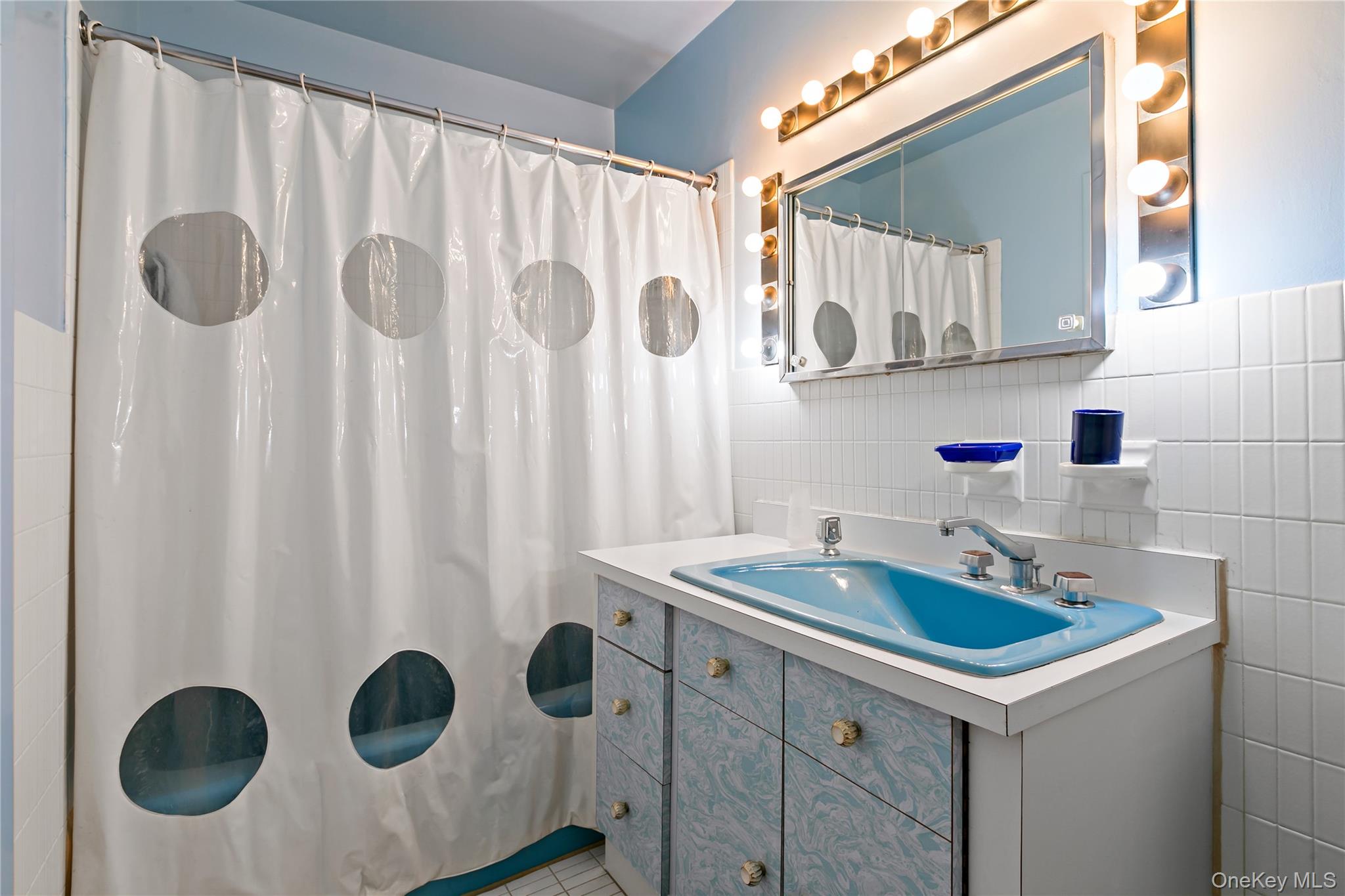 16 Meadow Road Scarsdale, NY 10583 - Photo 23 of 47 a kitchen with a sink and a refrigerator