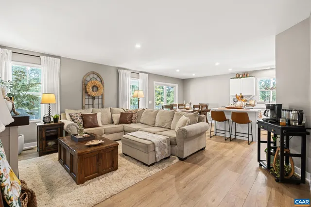 a living room with furniture fireplace and a flat screen tv