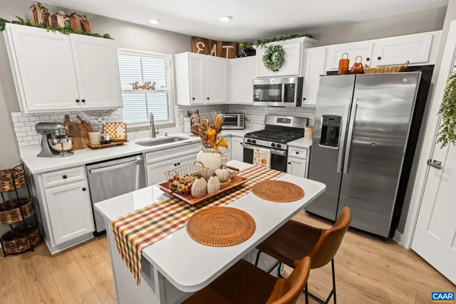 a view of a living room and dining room