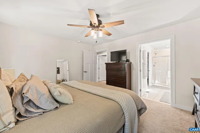 a bathroom with a double vanity sink toilet mirror and shower