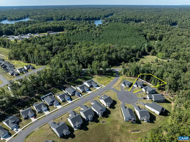 an aerial view of a house with a swimming pool