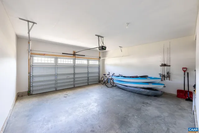 a view of empty room with wooden ceiling