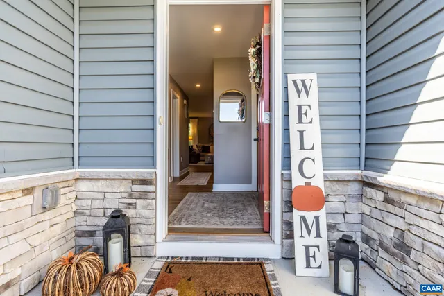 a view of a livingroom with furniture and front door