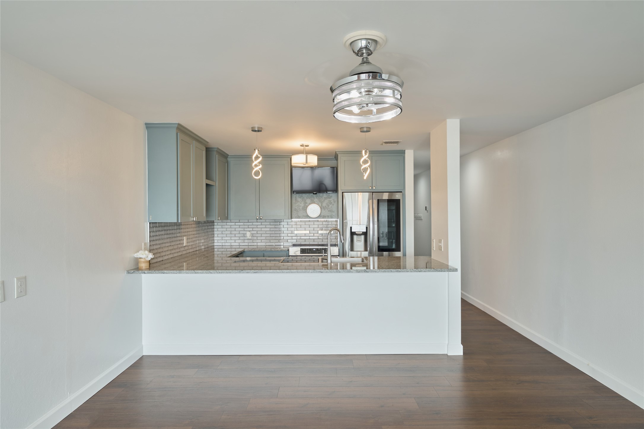801 River Road, Unit E111 Montgomery, TX 77356 - Photo 8 of 24 a view of a kitchen with a sink and refrigerator