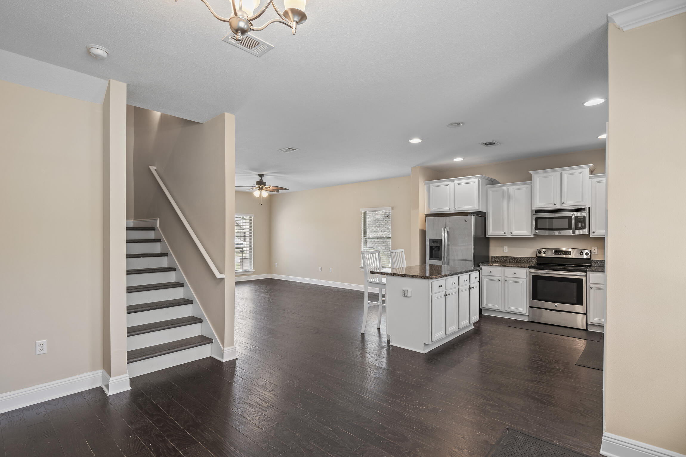 159 Lullaby Loop Santa Rosa Beach, FL 32459 - Photo 9 of 42 a kitchen with white cabinets and stainless steel appliances