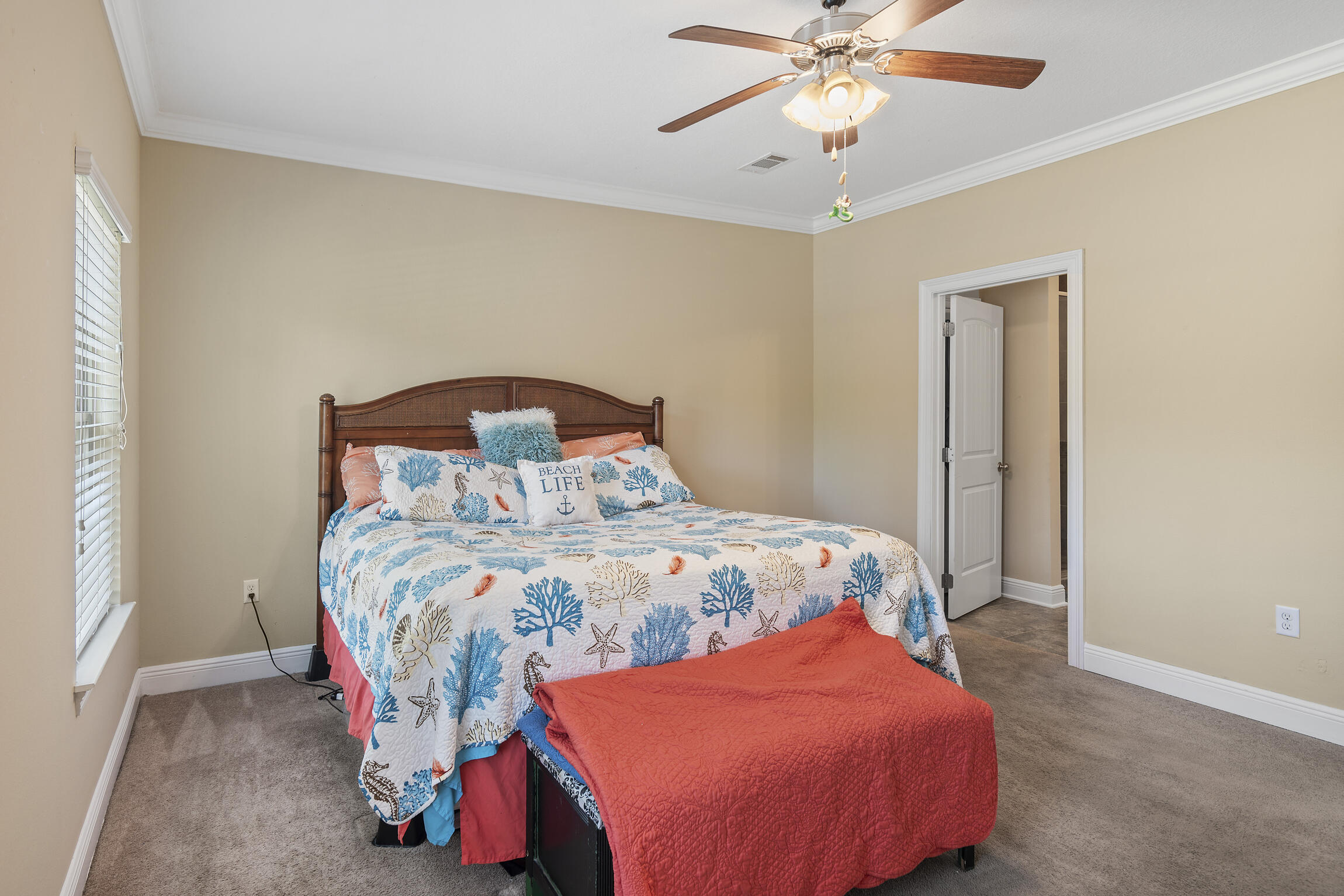 159 Lullaby Loop Santa Rosa Beach, FL 32459 - Photo 11 of 42 a bedroom with a bed and a chandelier