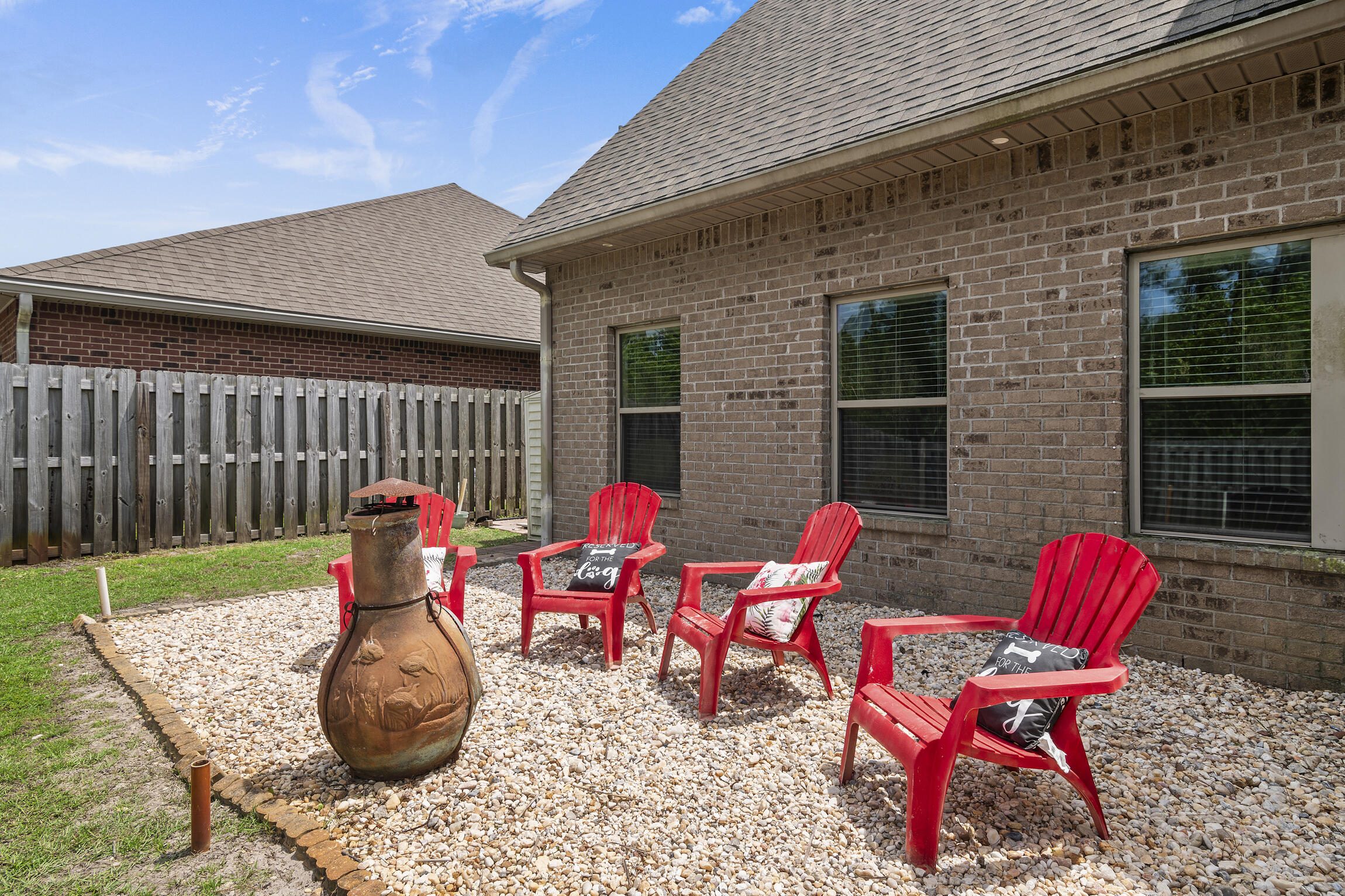 159 Lullaby Loop Santa Rosa Beach, FL 32459 - Photo 29 of 42 a backyard of a house with table and chairs