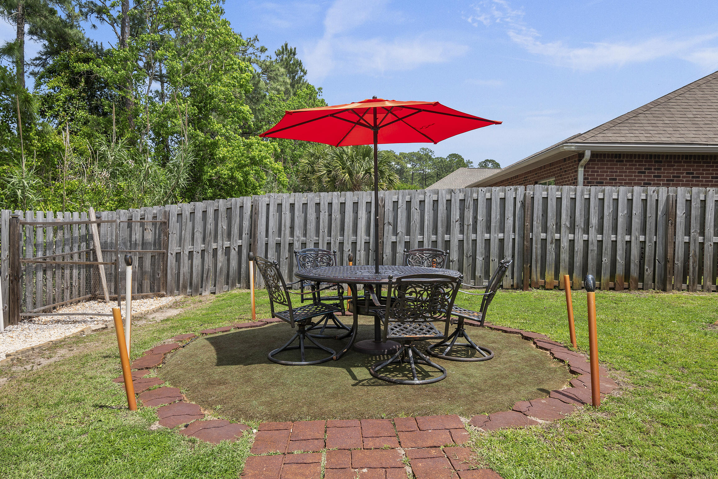 159 Lullaby Loop Santa Rosa Beach, FL 32459 - Photo 30 of 42 a view of backyard with table and chairs