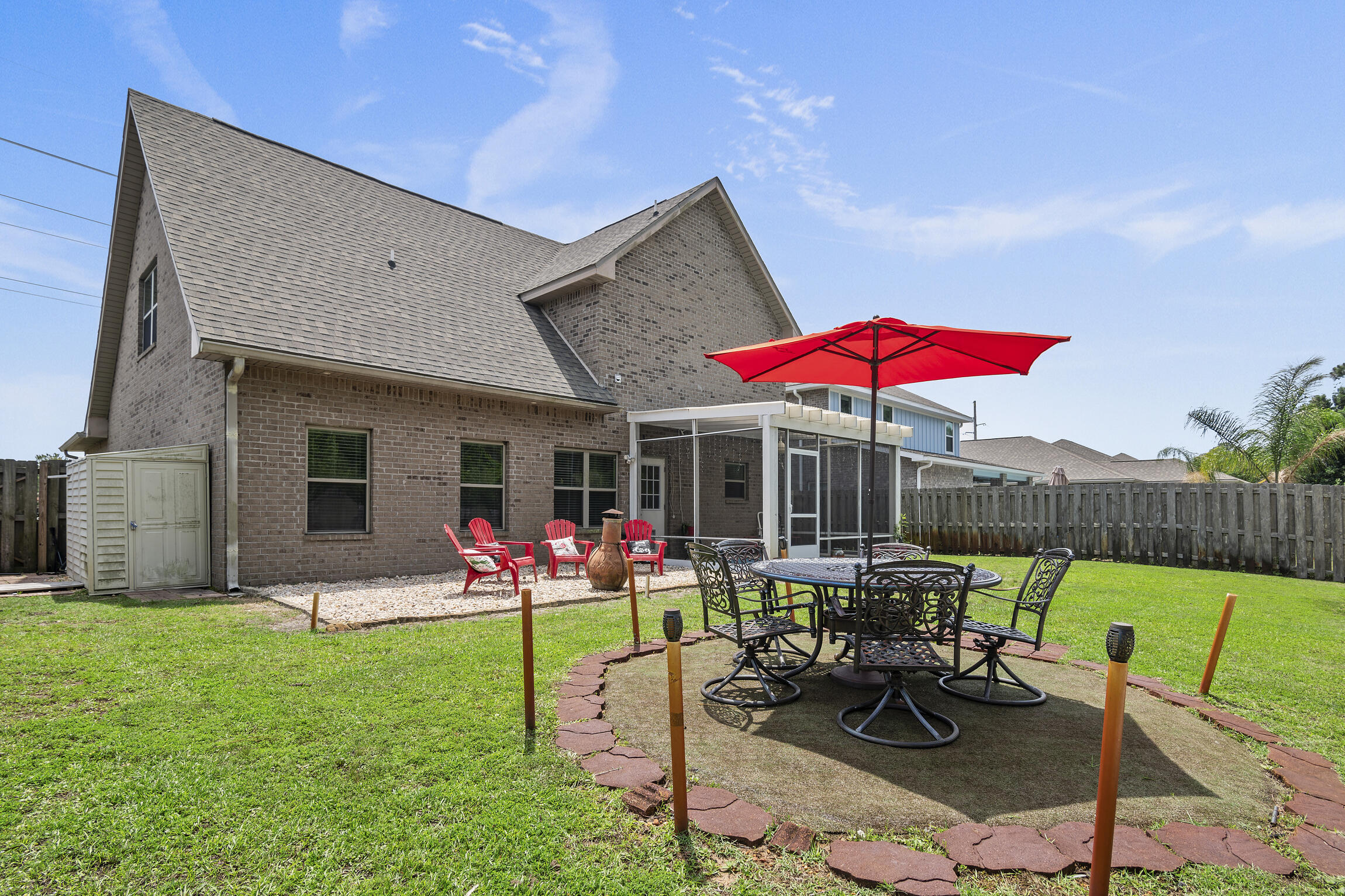 159 Lullaby Loop Santa Rosa Beach, FL 32459 - Photo 32 of 42 a view of a house with backyard sitting area and garden