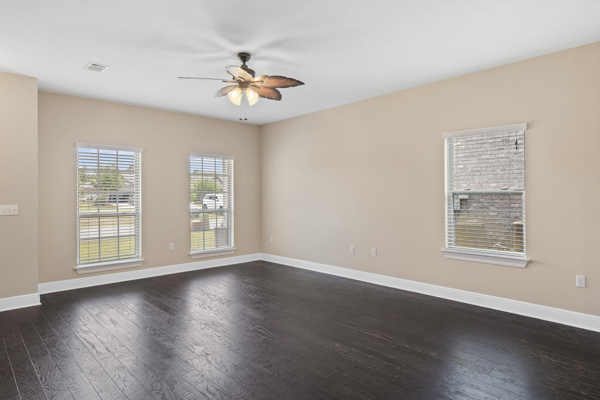 159 Lullaby Loop Santa Rosa Beach, FL 32459 - Photo 4 of 42 a view of an empty room with wooden floor and a window