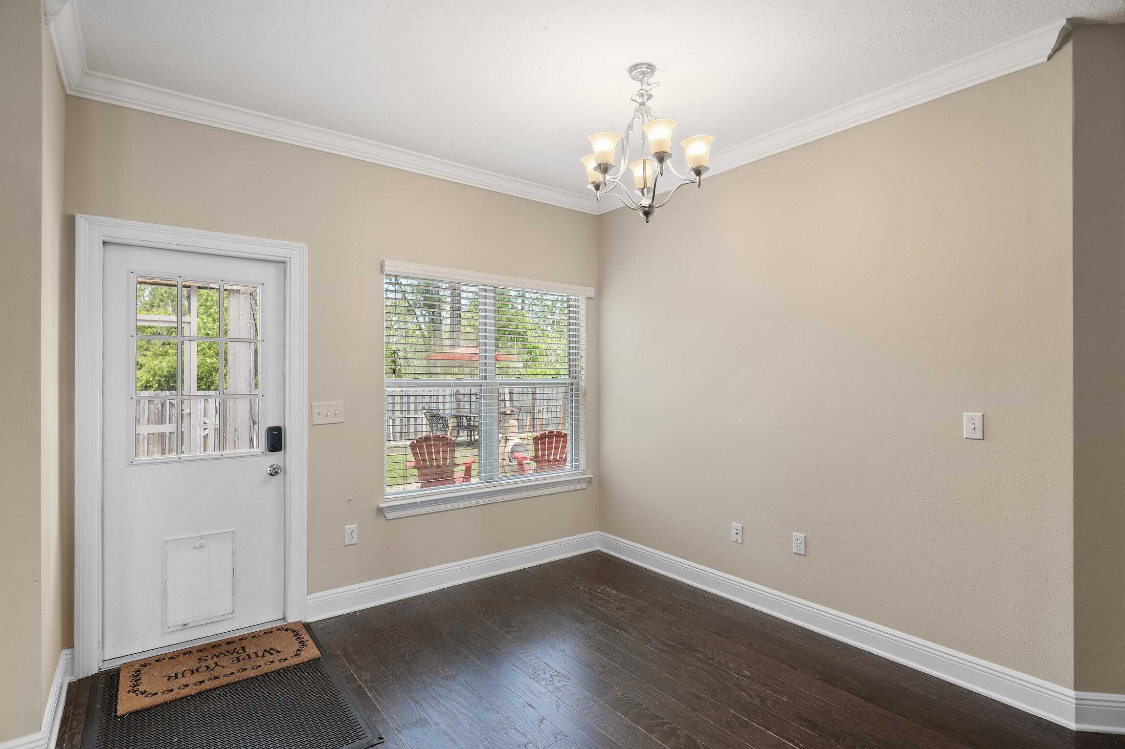 159 Lullaby Loop Santa Rosa Beach, FL 32459 - Photo 8 of 42 a view of an empty room with wooden floor and a window