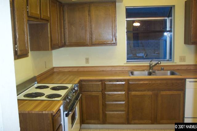 1191 Westlake Road Reno, NV 89523 - Photo 3 of 7 a kitchen with a sink and cabinets