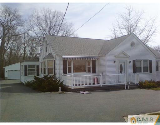 120 Main Street Edison, NJ 08837 - Photo 1 of 14 a front view of a house with a street