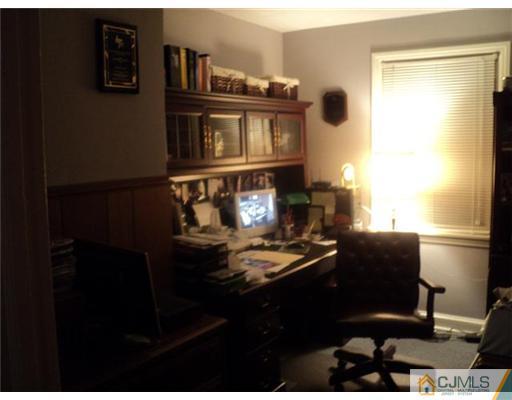 120 Main Street Edison, NJ 08837 - Photo 10 of 14 a living room with furniture and a window