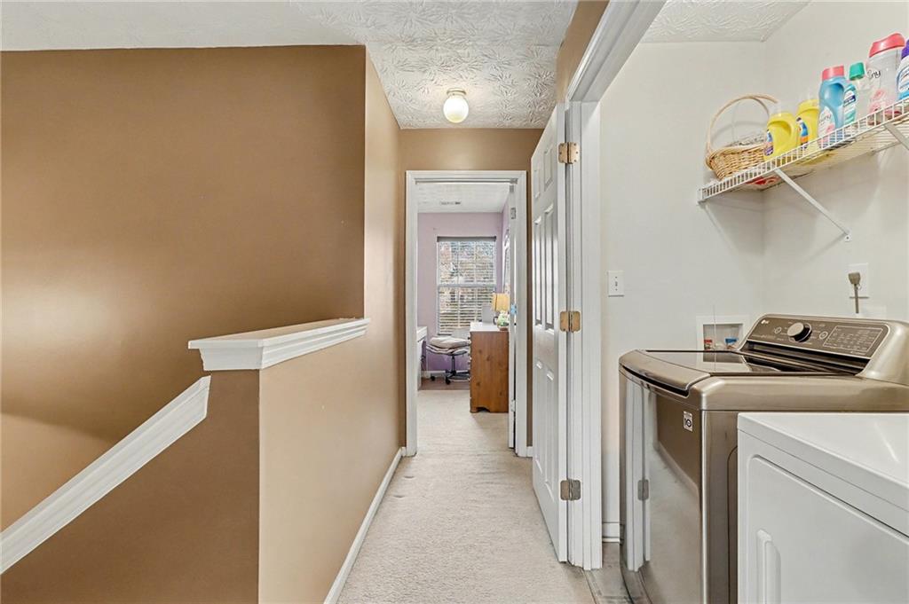 1777 Cutters Mill Way Lithonia, GA 30058 - Photo 16 of 23 a view of hallway with washer and dryer