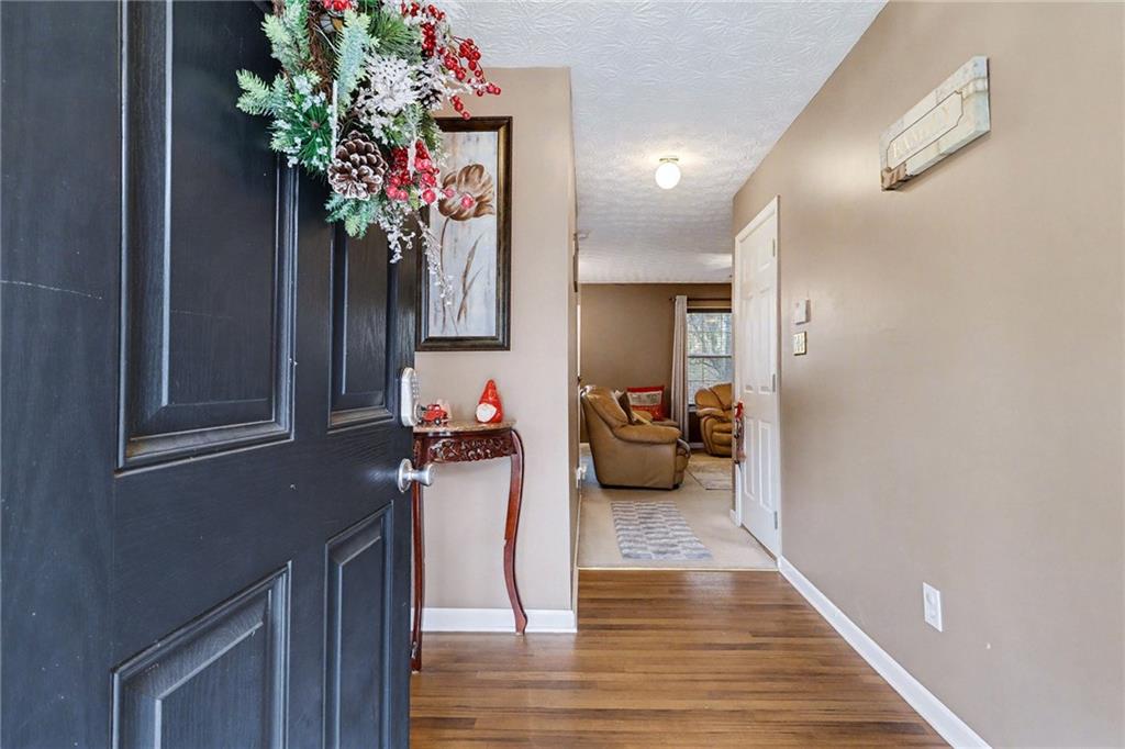 1777 Cutters Mill Way Lithonia, GA 30058 - Photo 2 of 23 a living room with furniture and a potted plant