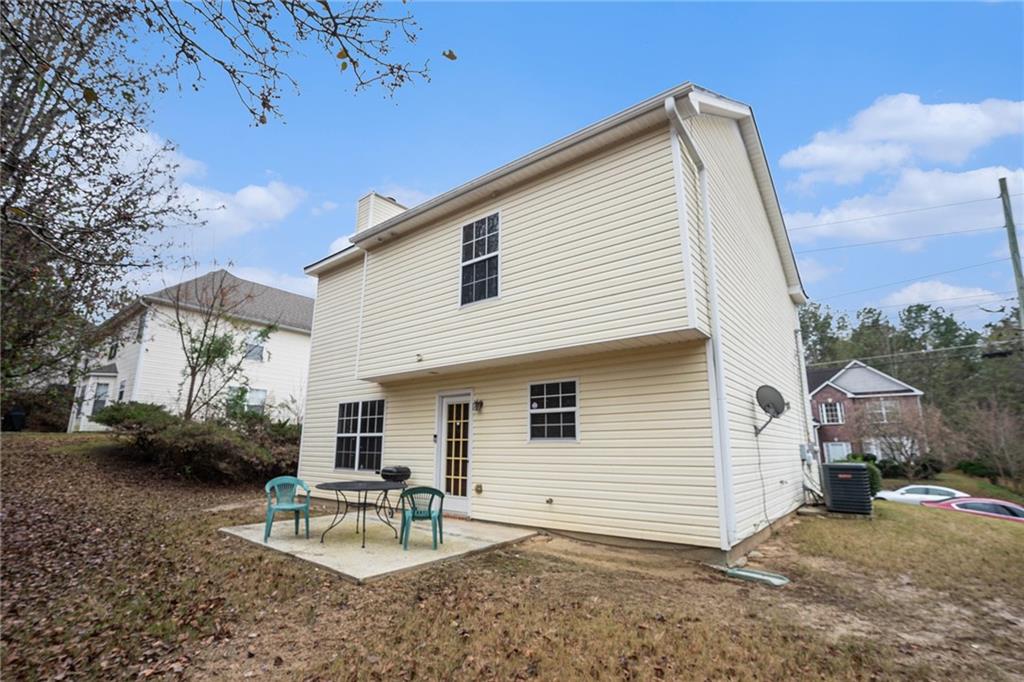 1777 Cutters Mill Way Lithonia, GA 30058 - Photo 21 of 23 a view of a house with a patio