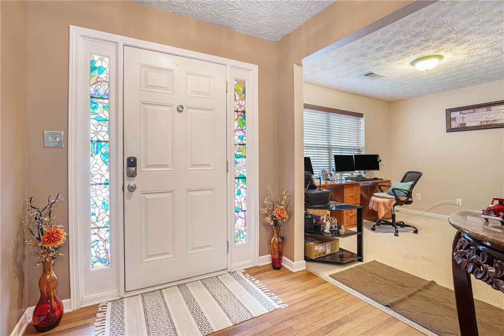 1777 Cutters Mill Way Lithonia, GA 30058 - Photo 3 of 23 a view of a workspace with furniture and a window