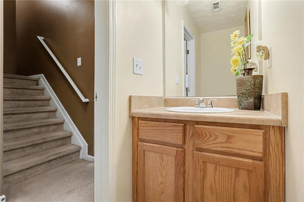 1777 Cutters Mill Way Lithonia, GA 30058 - Photo 5 of 23 a bathroom with a sink and a mirror