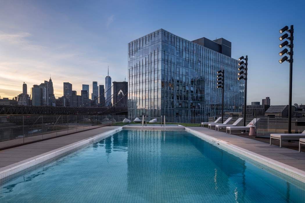 30 Front Street, Unit PHA Brooklyn, NY 11201 - Photo 15 of 35 a view of swimming pool outdoor seating and city view