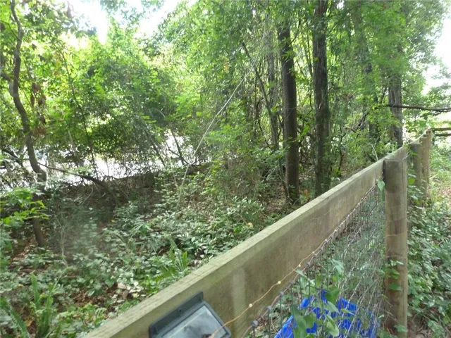 a view of a garden from a balcony
