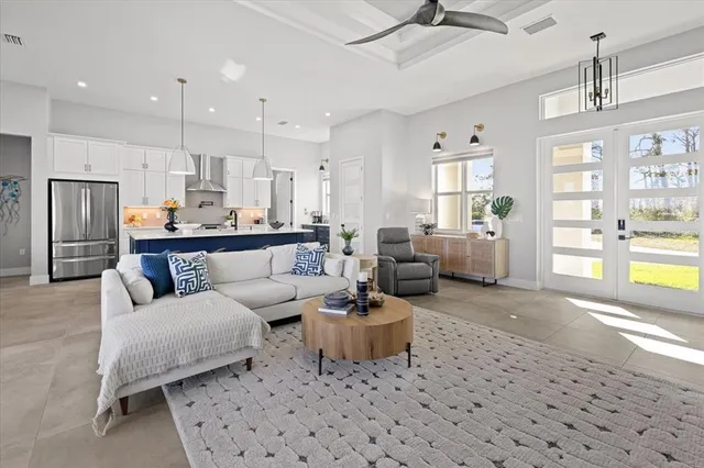 a bathroom with a granite countertop sink a mirror and a bathtub