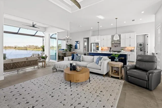 a bedroom with a bed and large windows