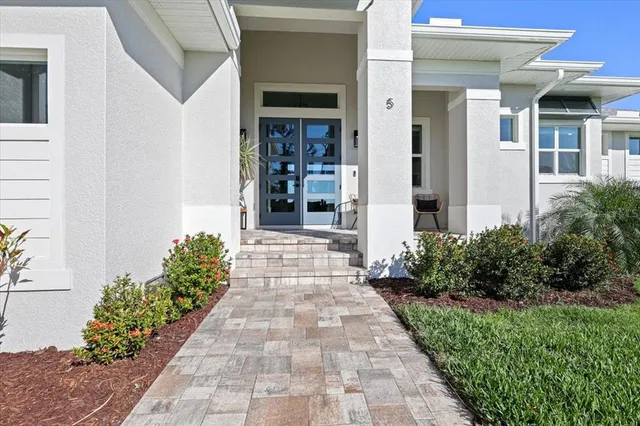 an aerial view of a house with a lake view