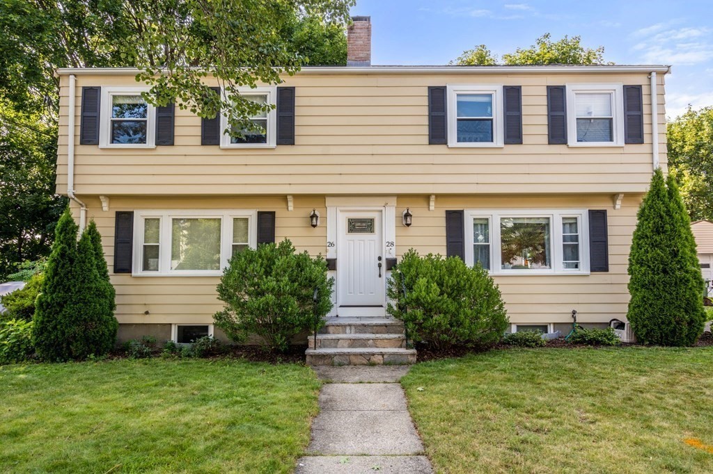 28 Rose Avenue, Unit 28 Watertown, MA 02472 - Photo 1 of 25 a front view of a house with garden