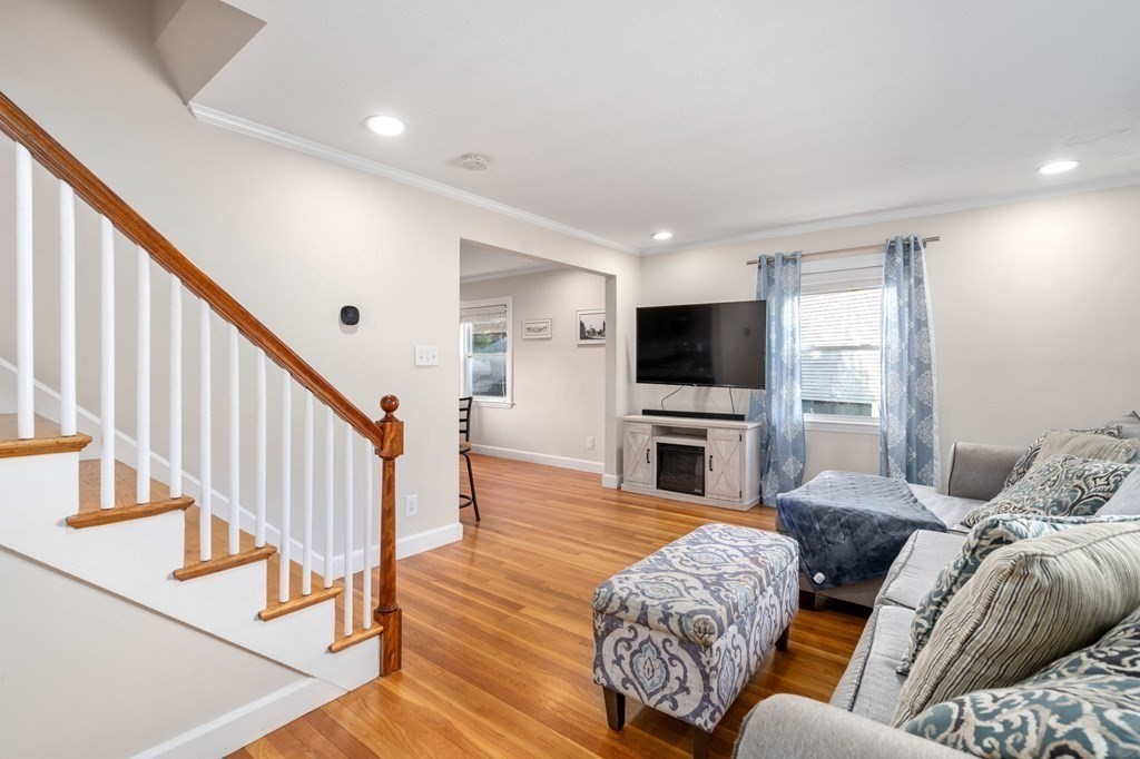 28 Rose Avenue, Unit 28 Watertown, MA 02472 - Photo 11 of 25 a living room with furniture flat screen tv and a fireplace