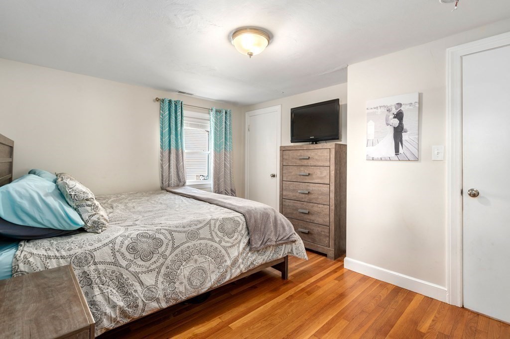 28 Rose Avenue, Unit 28 Watertown, MA 02472 - Photo 12 of 25 a bedroom with a bed and a television