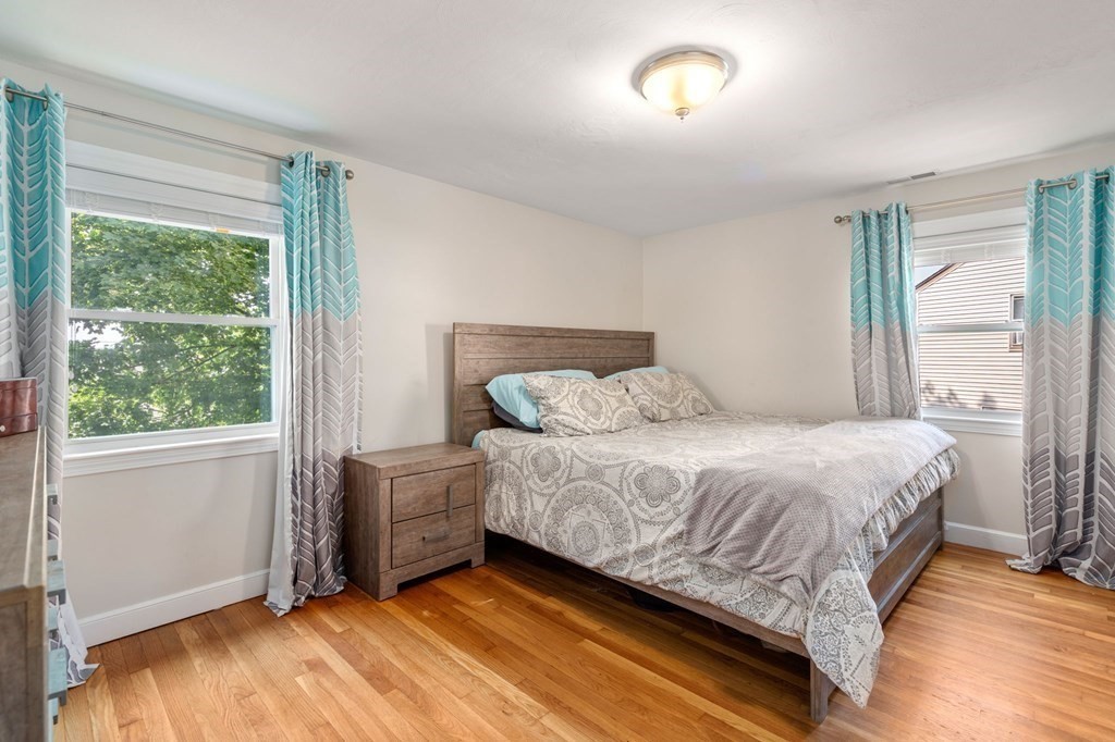 28 Rose Avenue, Unit 28 Watertown, MA 02472 - Photo 13 of 25 a bedroom with a bed and window