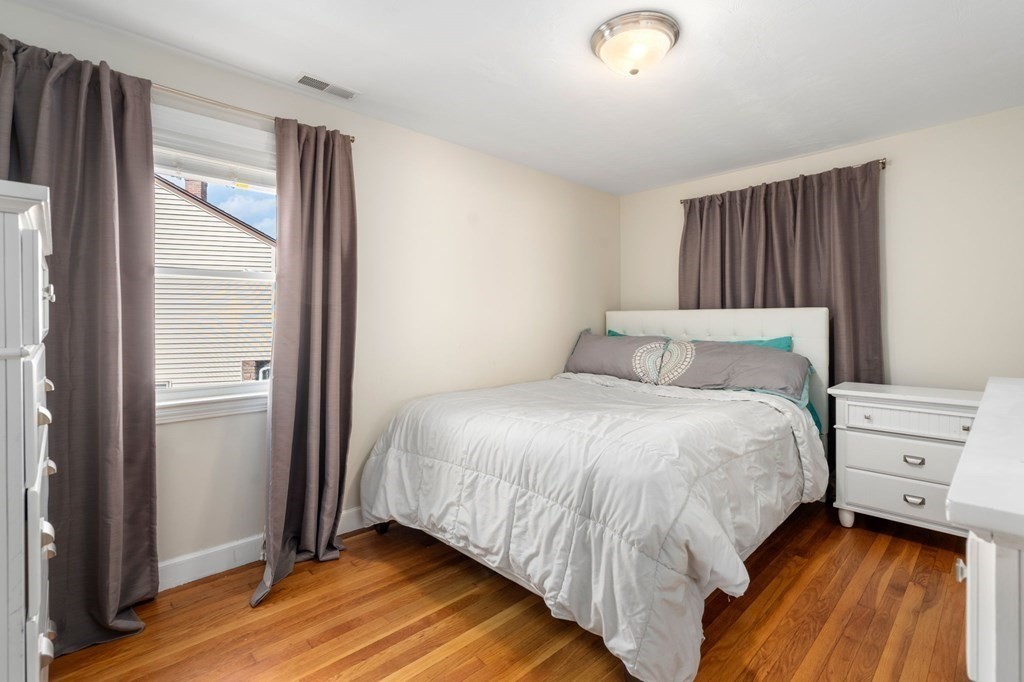 28 Rose Avenue, Unit 28 Watertown, MA 02472 - Photo 15 of 25 a bedroom with a bed and a window