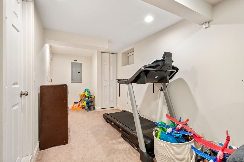28 Rose Avenue, Unit 28 Watertown, MA 02472 - Photo 20 of 25 a view of a room with gym equipment