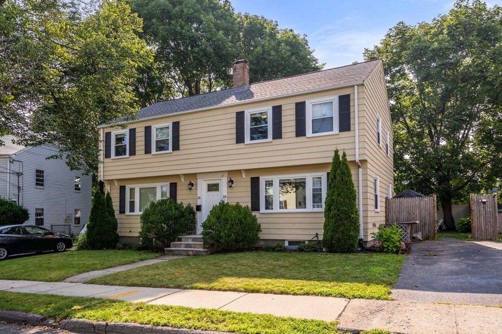 28 Rose Avenue, Unit 28 Watertown, MA 02472 - Photo 2 of 25 a front view of a house with a garden
