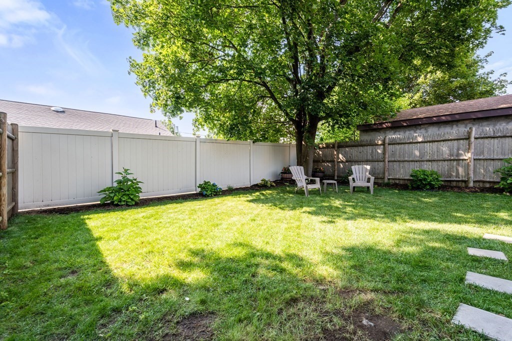 28 Rose Avenue, Unit 28 Watertown, MA 02472 - Photo 24 of 25 a backyard of a house with lots of green space