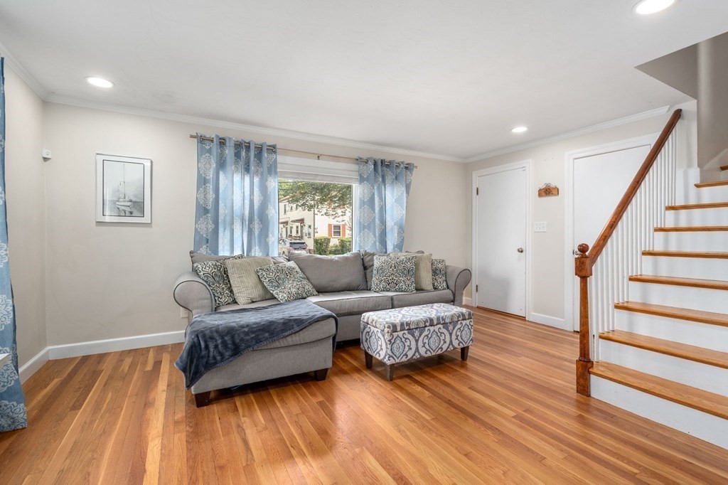 28 Rose Avenue, Unit 28 Watertown, MA 02472 - Photo 10 of 25 a living room with furniture and a wooden floor