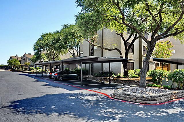 6910 Skillman Street, Unit 1007 Dallas, TX 75231 - Photo 11 of 24 a front view of a house with garden