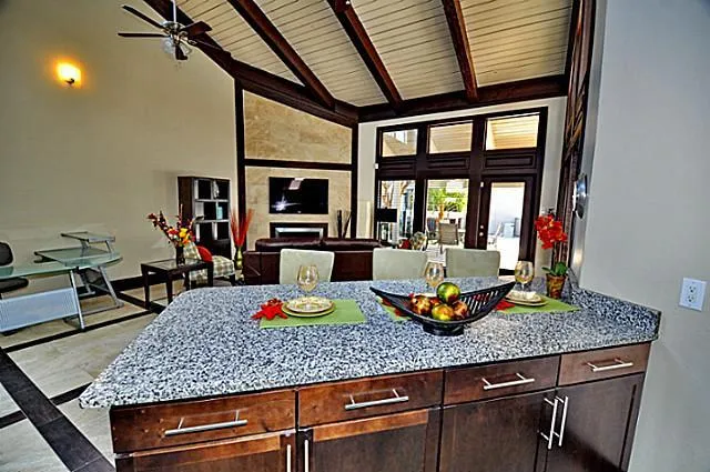 a view of a dining room with furniture a chandelier and wooden floor