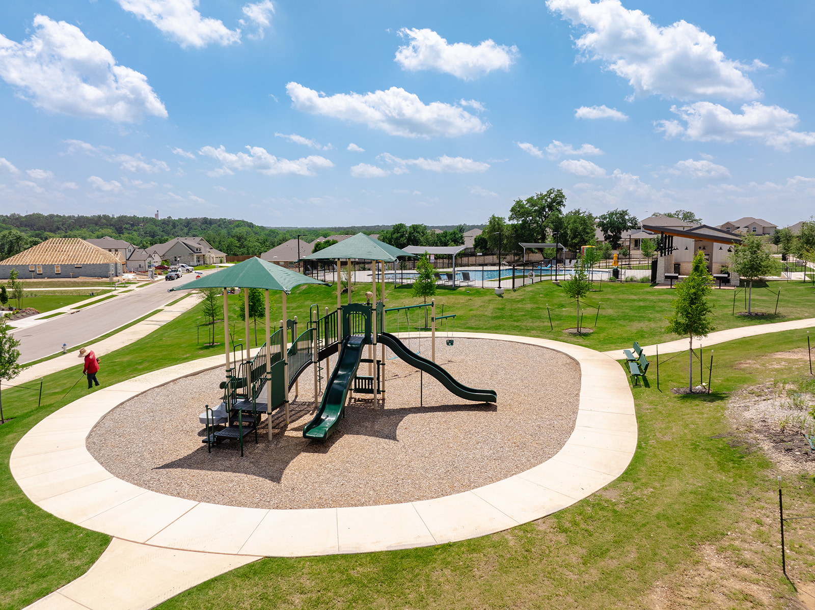 900 Balsora Cove Georgetown, TX 78628 - Photo 36 of 39 A vibrant playground set amidst a verdant community park, perfect for family enjoyment.