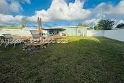 a view of swimming pool with a yard in back