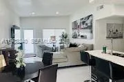 a view of kitchen and dining room with a table chairs