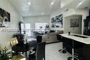 a kitchen with stainless steel appliances kitchen island granite countertop a sink and cabinets