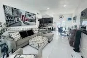 a kitchen with a sink cabinets and window