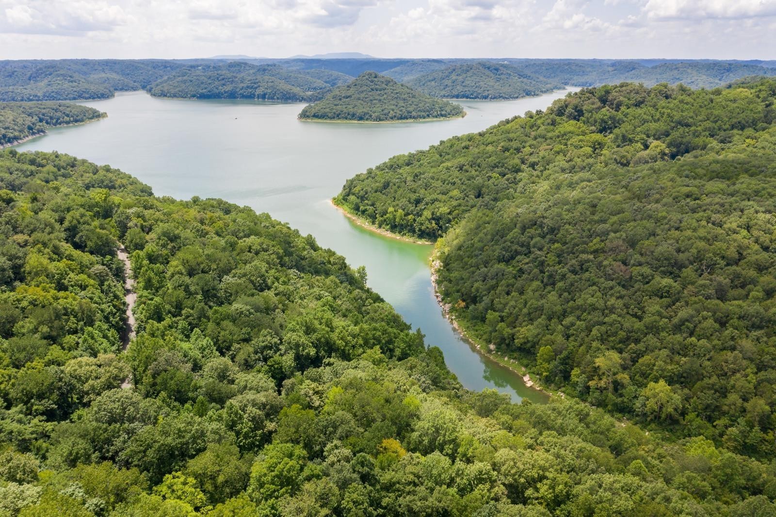 21 Harbor Point Road Silver Point, TN 38582 - Photo 6 of 7 a view of a lake with a yard